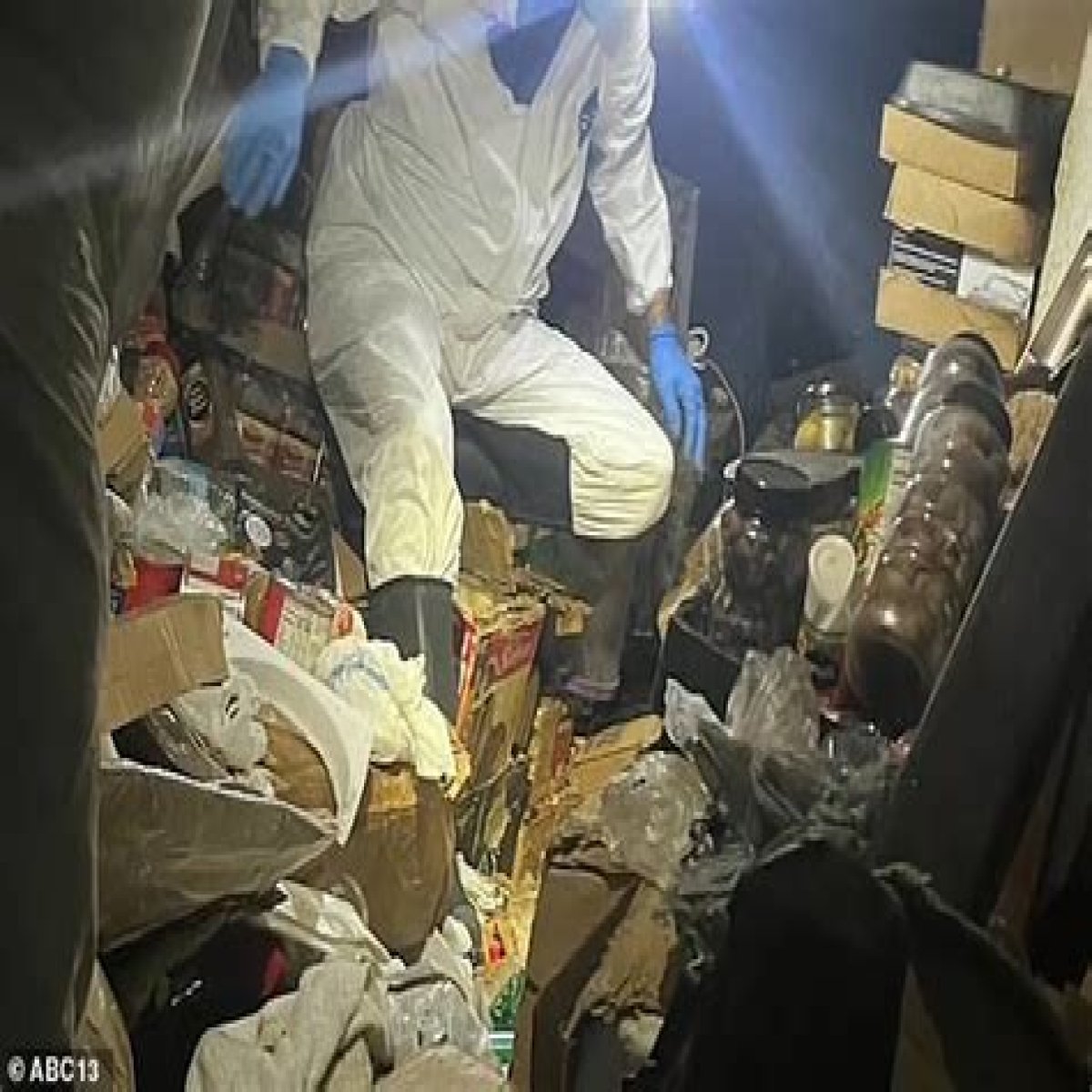Houston hoarder is found dead under four-feet of debris inside his townhome after residents who 'had not seen him in months' grew concerned over 'foul odor'